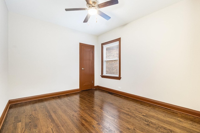 empty room featuring ceiling fan and hardwood / wood-style floors