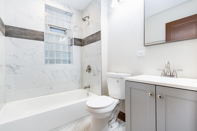 full bathroom with tiled shower / bath, vanity, and toilet