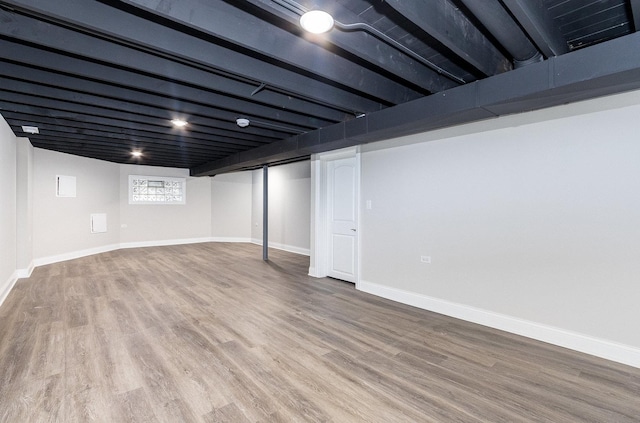 basement featuring hardwood / wood-style flooring