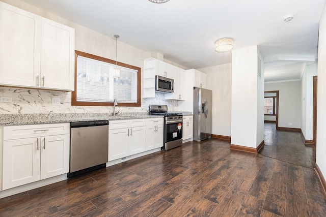 kitchen with decorative light fixtures, white cabinetry, decorative backsplash, dark hardwood / wood-style flooring, and appliances with stainless steel finishes