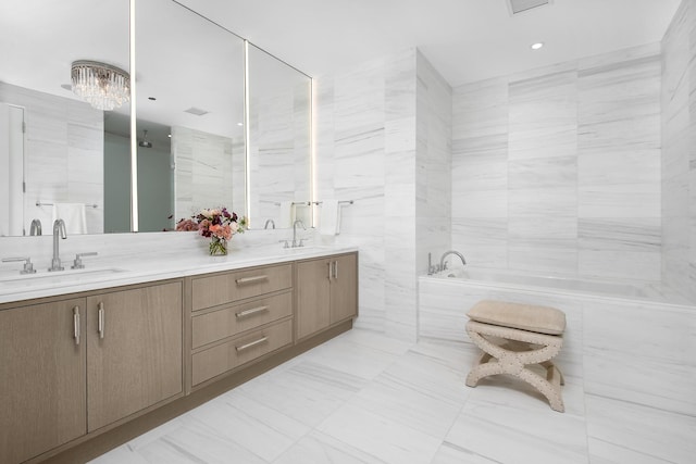 bathroom featuring tile walls, a washtub, and vanity