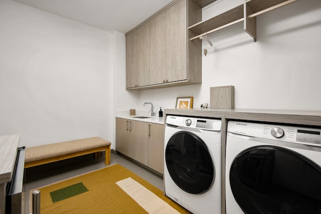 laundry room featuring sink, separate washer and dryer, and cabinets