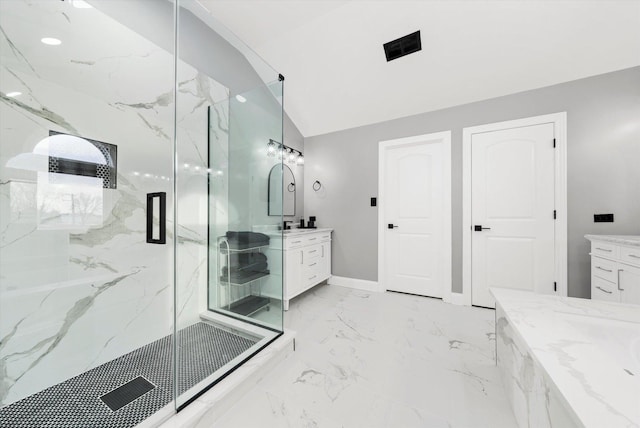 bathroom with vanity, lofted ceiling, and walk in shower