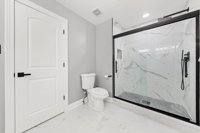 bathroom featuring toilet and walk in shower