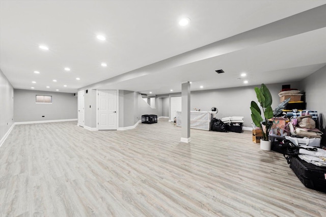 basement featuring light wood-type flooring