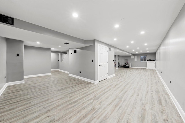 basement featuring light hardwood / wood-style floors