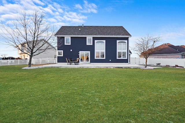 back of property featuring a yard and a patio