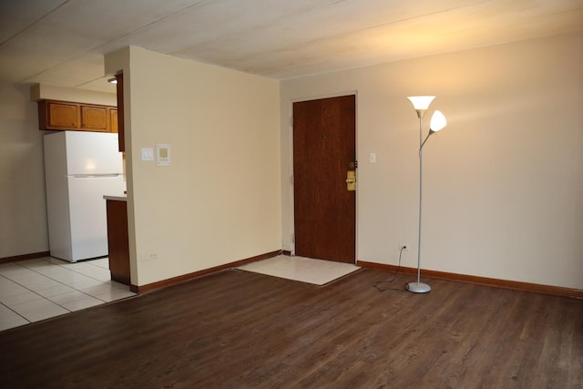 spare room featuring light hardwood / wood-style flooring