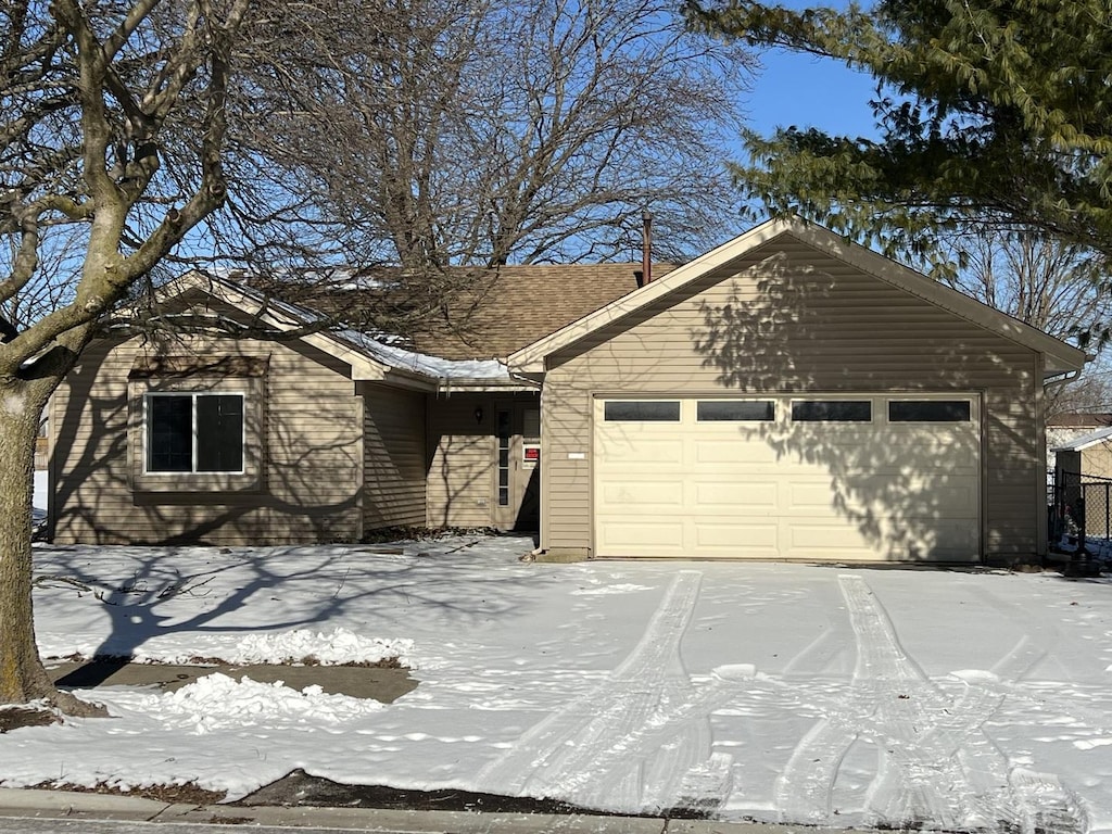 single story home featuring a garage