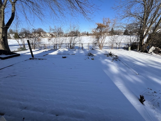 view of yard layered in snow