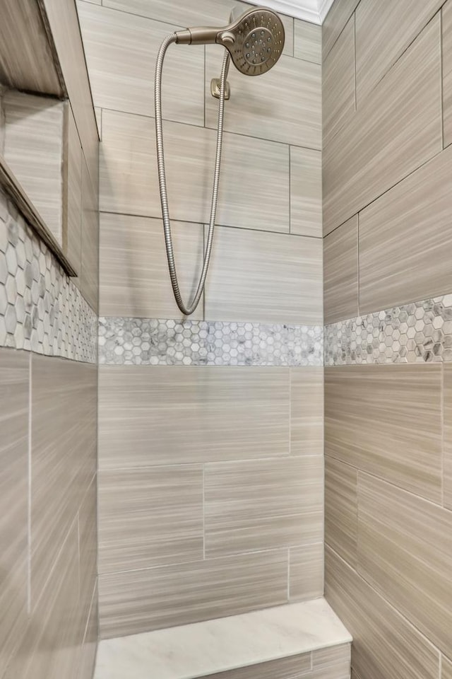 bathroom with tiled shower