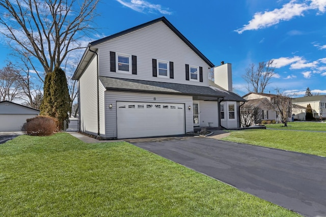 front facade with a front yard and a garage