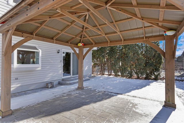 snow covered patio with a gazebo