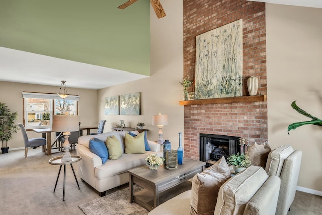 carpeted living room with a brick fireplace