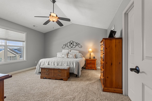 carpeted bedroom featuring ceiling fan and vaulted ceiling