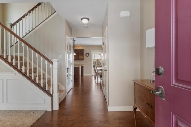 foyer entrance featuring dark wood-type flooring