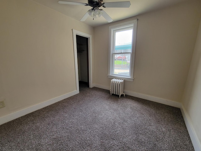 407 E Walnut St, Oglesby, IL 61348 - unfurnished bedroom featuring radiator heating unit, carpet, and baseboards