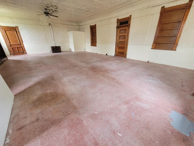 407 E Walnut St, Oglesby, IL 61348 - unfurnished living room with ceiling fan, carpet flooring, and an ornate ceiling