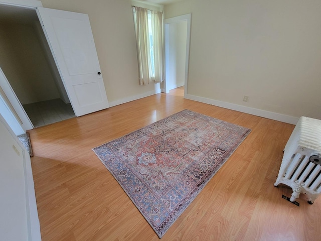 407 E Walnut St, Oglesby, IL 61348 - empty room featuring wood finished floors and baseboards