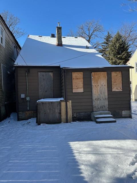 view of snow covered house