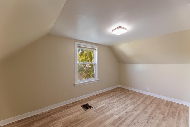 unfurnished room with hardwood / wood-style flooring and crown molding