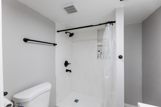 full bathroom featuring ornamental molding, tiled shower / bath combo, vanity, and toilet