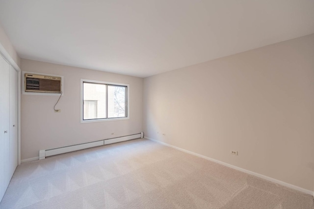 unfurnished bedroom with a closet, light colored carpet, an AC wall unit, and a baseboard radiator