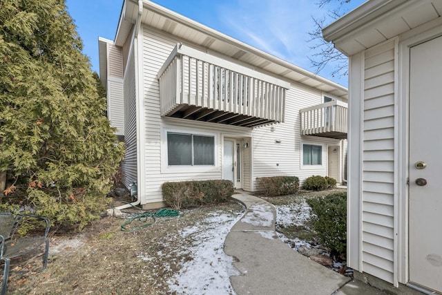 view of front of property with a balcony