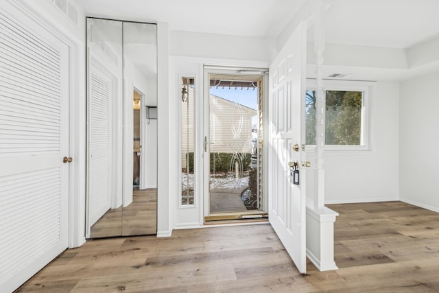 foyer with light hardwood / wood-style flooring