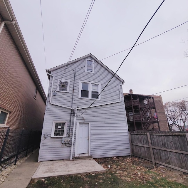 rear view of house featuring a patio