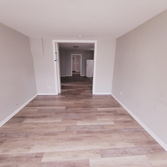 unfurnished room featuring light hardwood / wood-style floors