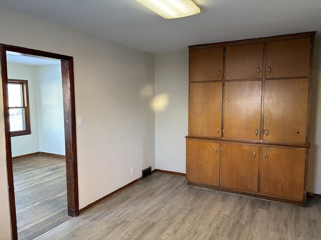 unfurnished bedroom featuring light hardwood / wood-style flooring