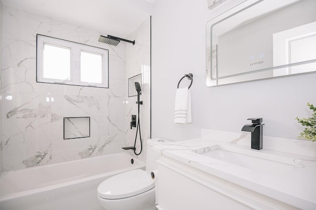 full bathroom featuring toilet, vanity, and tiled shower / bath combo