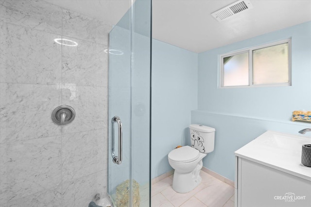 bathroom with toilet, an enclosed shower, tile patterned floors, and vanity