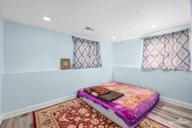 bedroom with light hardwood / wood-style floors