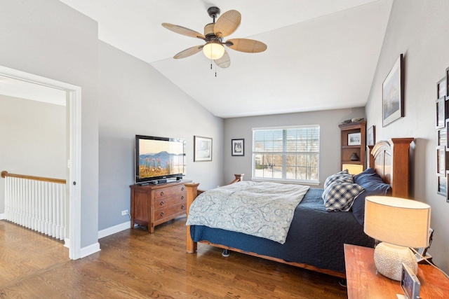 bedroom featuring vaulted ceiling, dark hardwood / wood-style floors, and ceiling fan