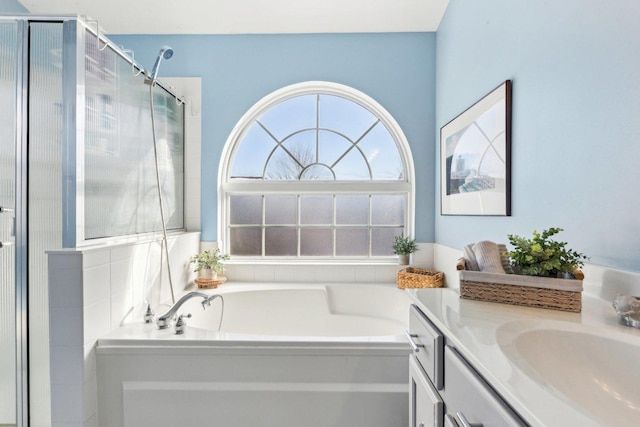 bathroom with vanity and plus walk in shower