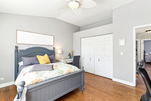 bedroom featuring hardwood / wood-style flooring, ceiling fan, vaulted ceiling, and a closet