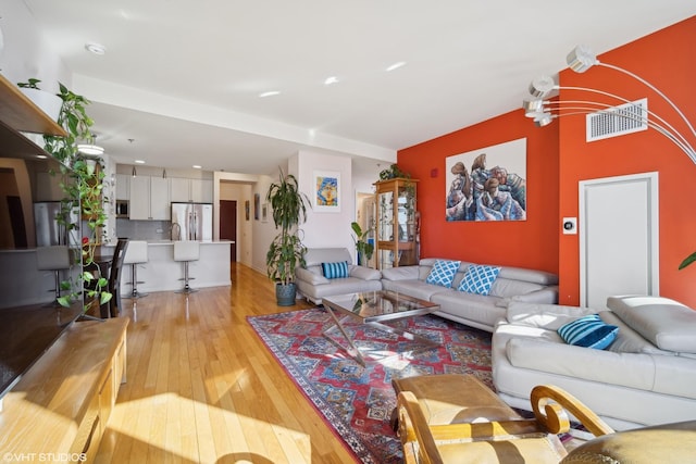 living area featuring light wood finished floors