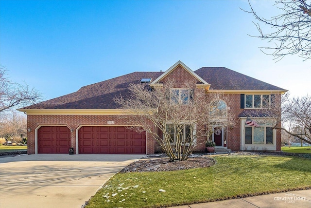 view of front of property with a front lawn and a garage