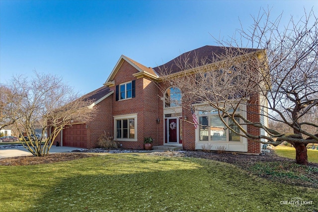 view of front of house with a front lawn and a garage