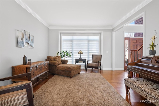 sitting room with ornamental molding and hardwood / wood-style floors