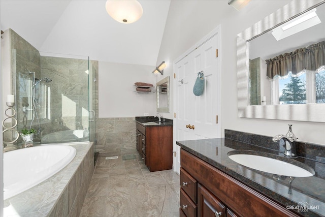 bathroom with vanity, lofted ceiling with skylight, and plus walk in shower