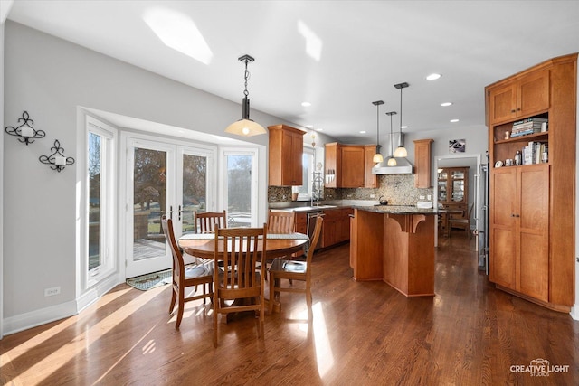 dining room featuring sink, french doors, and dark hardwood / wood-style floors