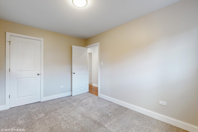 unfurnished bedroom with carpet