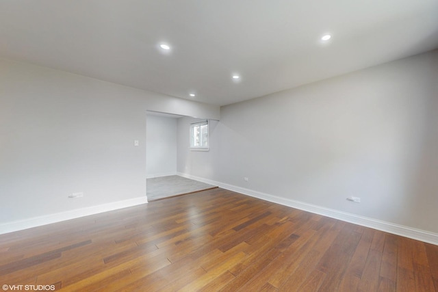 empty room with wood-type flooring