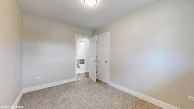 unfurnished bedroom with carpet floors