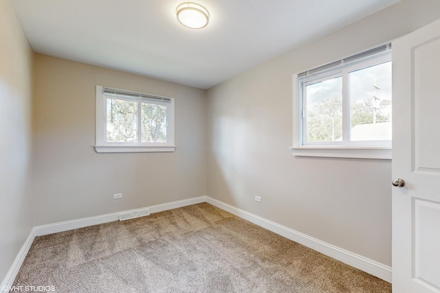 view of carpeted spare room