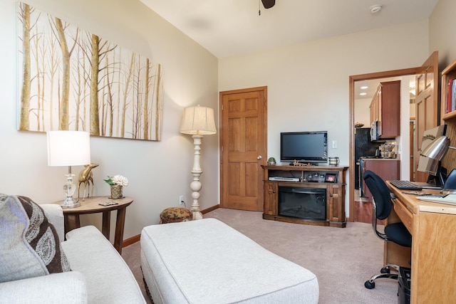 carpeted office featuring ceiling fan