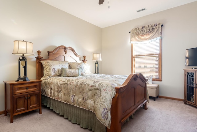 bedroom featuring light carpet and ceiling fan